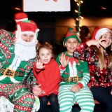 Santa Claus and his elves celebrate Christmas at the Lemoore Christmas Parade.